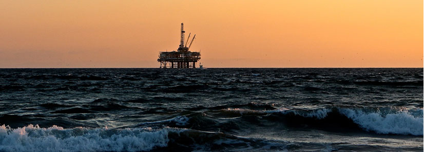 oil rig on the horizen at sunset
